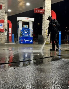 gas station power washing at night